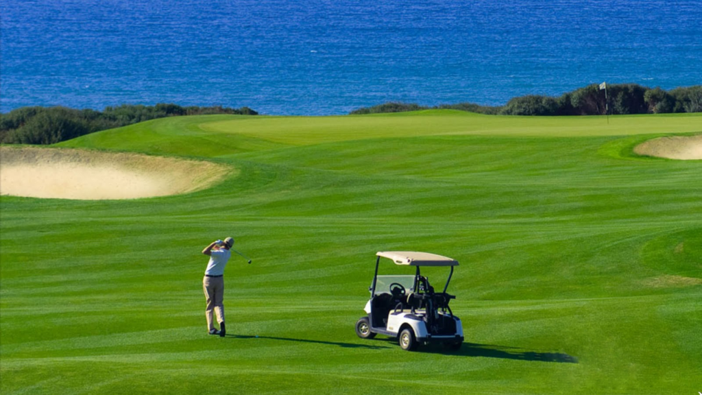 Golfer playing at Danang golf course with ocean view – perfect golf and beach holiday in Vietnam