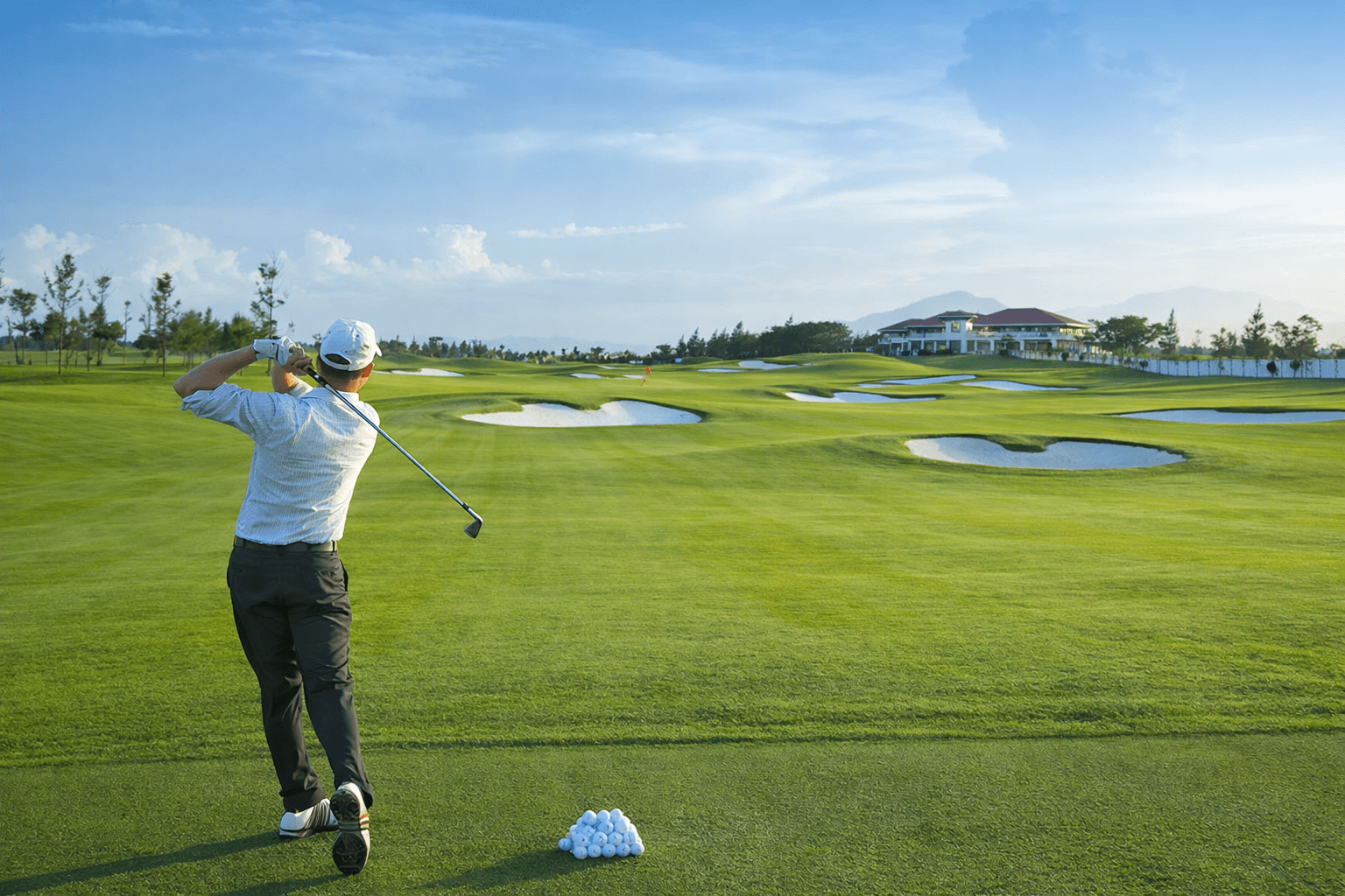 golfer playing on Vietnam golf course safe travel destination clean professional golf environment