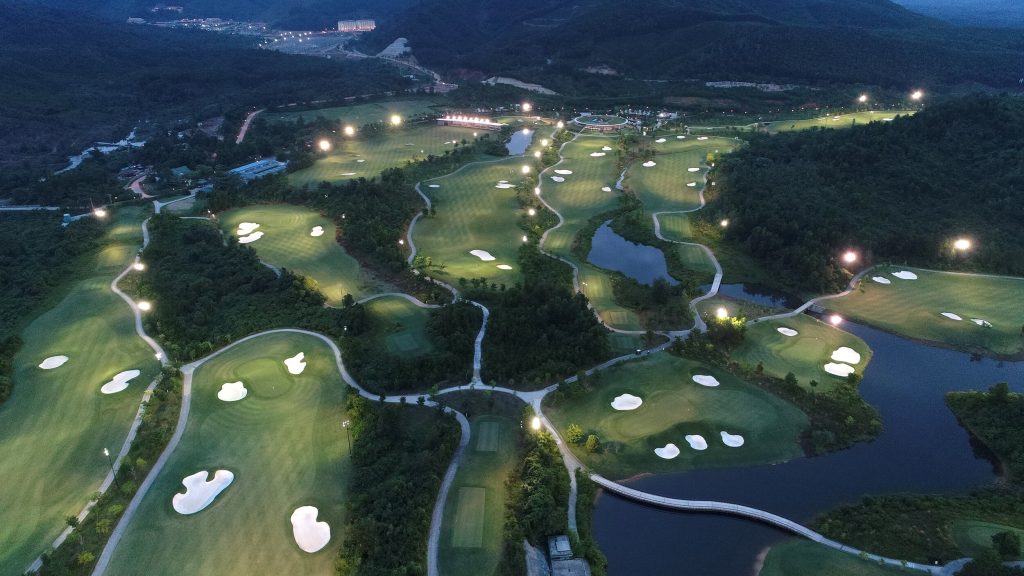 Ba Na Hills Golf Club night aerial view with illuminated course Da Nang Vietnam