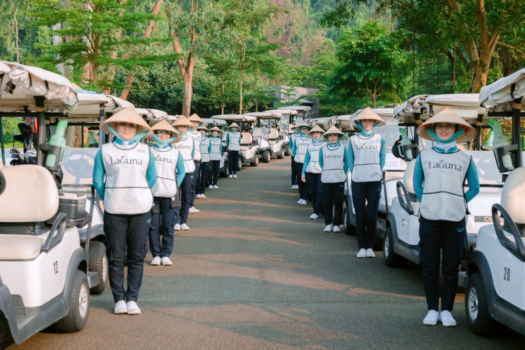 Golf caddies at Laguna Golf Lang Co Vietnam ready for players on course