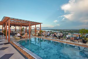 Rooftop swimming pool at Royal Riverside Hotel Hoi An with city view