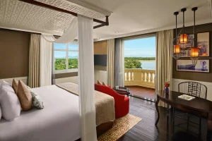 Deluxe room at Royal Riverside Hotel Hoi An with balcony and river view