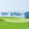 FLC Ha Long Bay Golf Club green with bunkers overlooking Ha Long Bay karsts