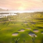 Tuan Chau Golf Resort bunkers at sunrise with Ha Long Bay in the distance