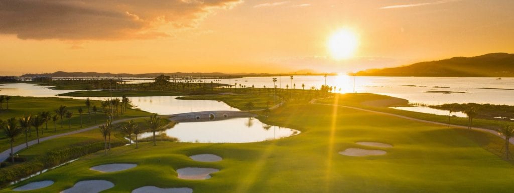 Sunset over Tuan Chau Golf Resort water hazard near Ha Long Bay