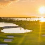 Sunset over Tuan Chau Golf Resort water hazard near Ha Long Bay