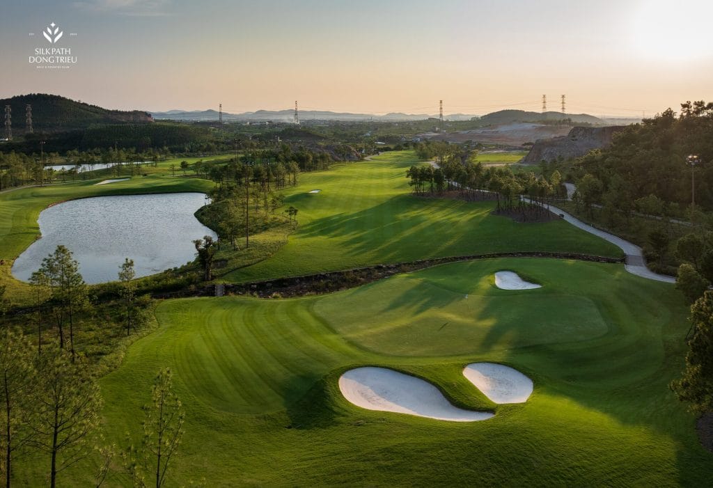 Silk Path Dong Trieu Golf and Country Club hole with lake and elevation change