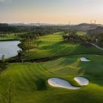 Silk Path Dong Trieu Golf and Country Club hole with lake and elevation change