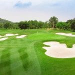 Aerial close-up of flower-shaped white sand bunkers around the green at BRG Legend Hill Golf Resort