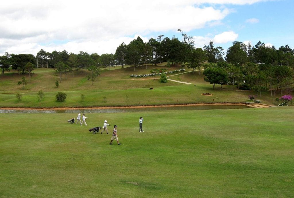 Golfers walking a fairway at Dalat Palace Golf Club
