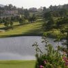 Dalat Palace Golf Club lakes with Da Lat city behind