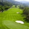 Aerial view of a SAM Tuyen Lam Golf Club fairway and green near Tuyen Lam Lake