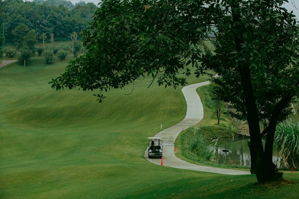 Golf cart on a winding path at Sapa Grand Golf Course, Lao Cai