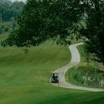Golf cart on a winding path at Sapa Grand Golf Course, Lao Cai