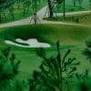 Sapa Grand Golf Course green and bunker framed by young pines