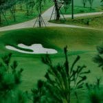 Sapa Grand Golf Course green and bunker framed by young pines