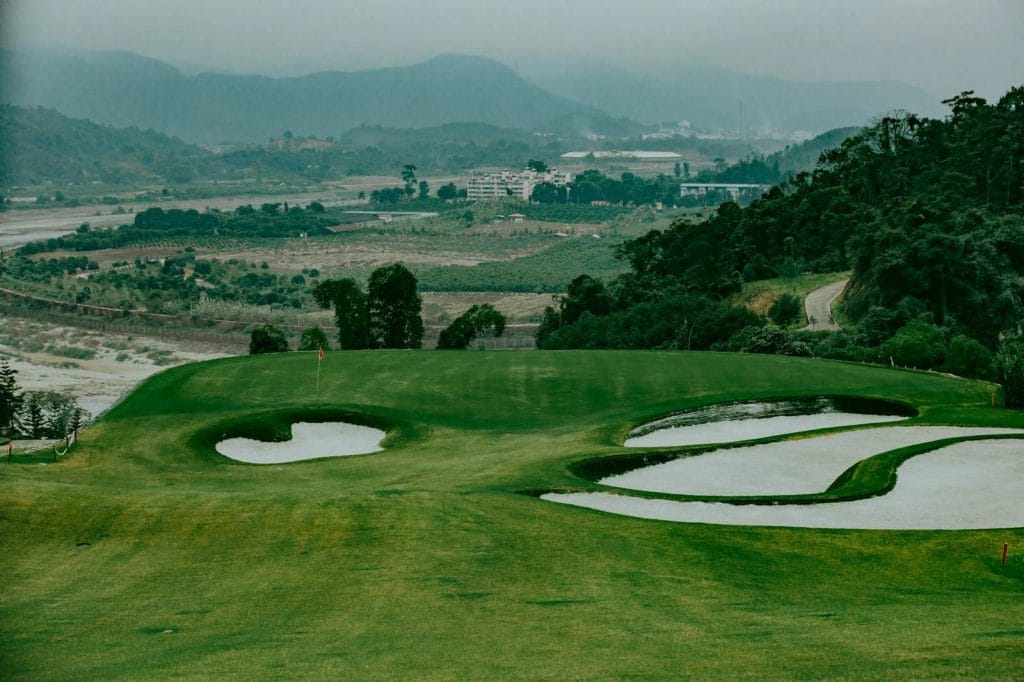 Sapa Grand Golf Course green with bunkers above the Red River valley near Bat Xat