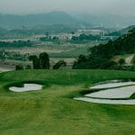 Sapa Grand Golf Course green with bunkers above the Red River valley near Bat Xat