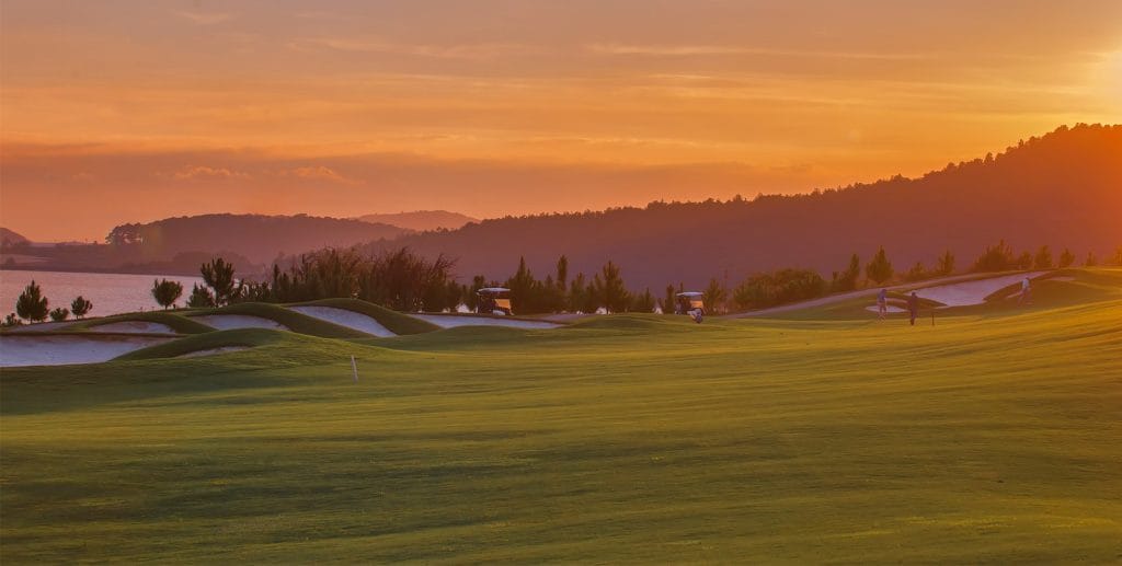 Sunset over The Dalat at 1200 golf course and its lake