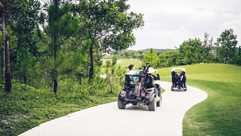 Golf carts on a winding cart path at Yen Bai Star Golf & Resort