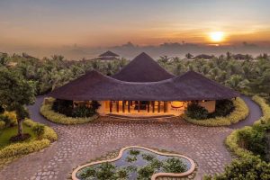 Ana Mandara Cam Ranh resort entrance with thatched roofs at sunrise on the Cam Ranh Peninsula