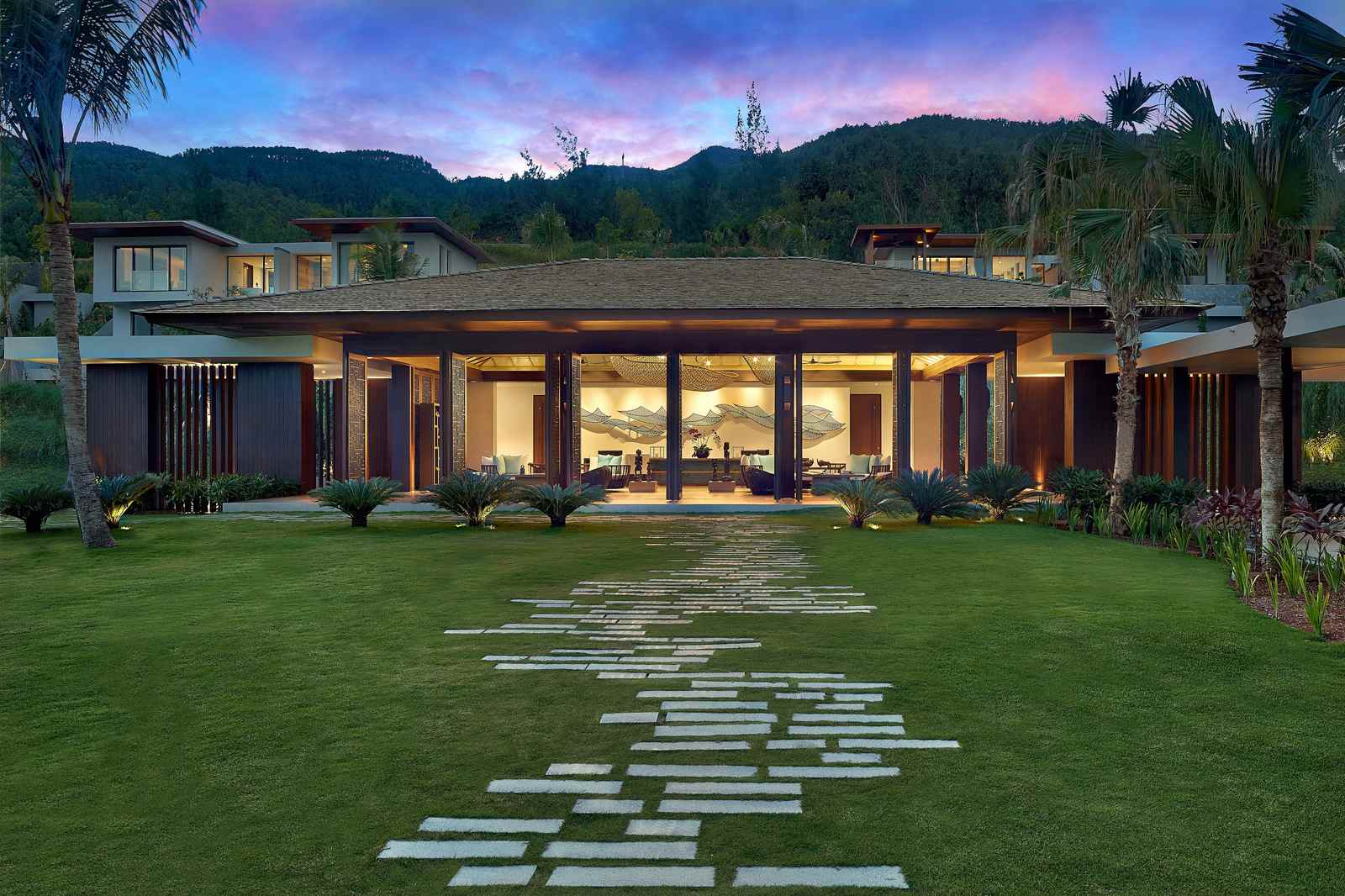 Lobby pavilion and lawn at Anantara Quy Nhon Villas at dusk