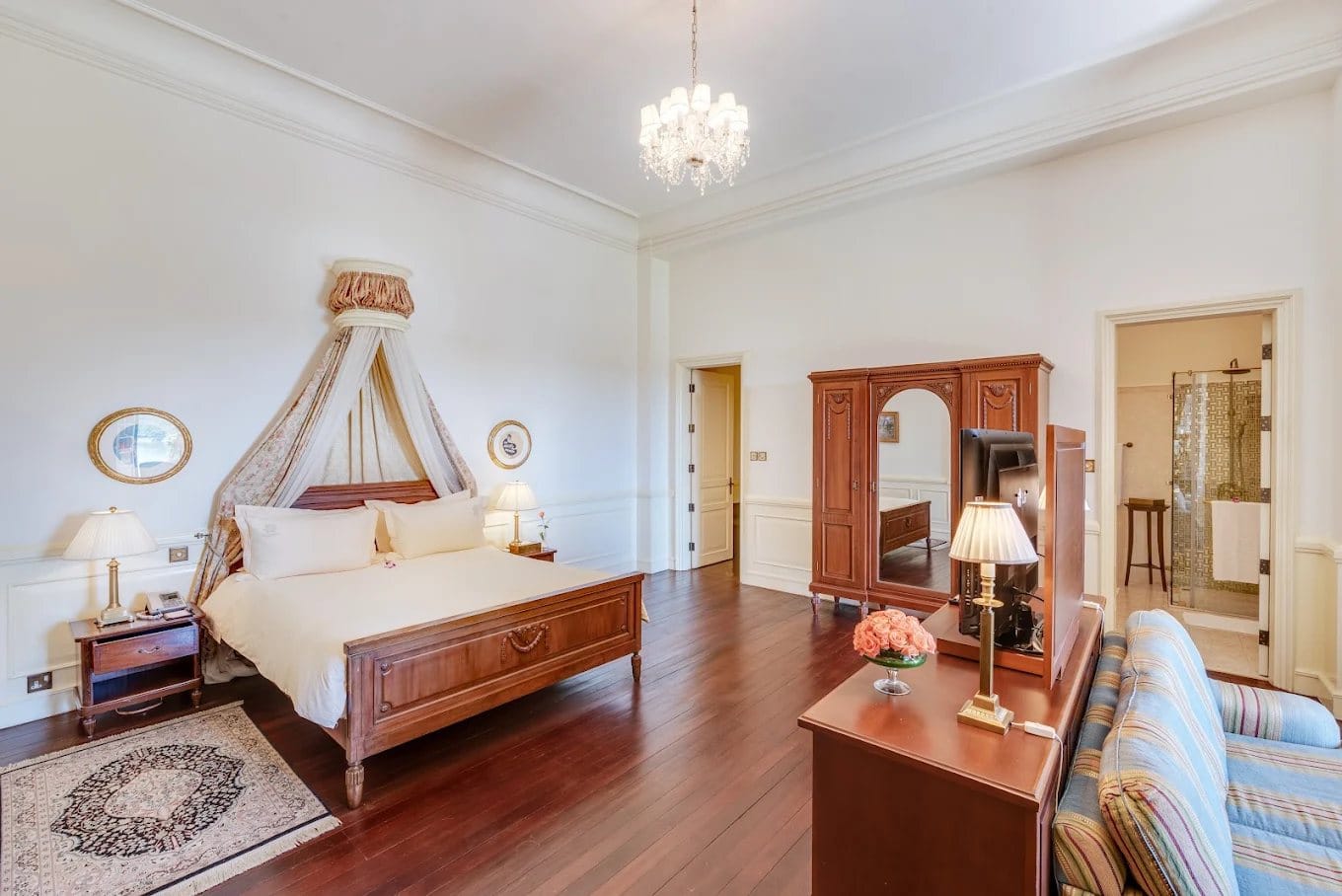 Guest room with canopy bed at Dalat Palace Heritage Hotel
