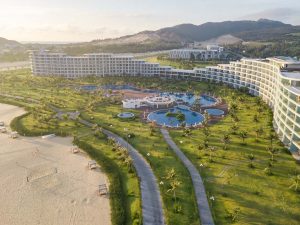 Aerial view of FLC Luxury Hotel Quy Nhon, its pools and Nhon Ly beach