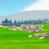 Wide fairway and bunkers on the FLC Quy Nhon Mountain Course with mountains in the distance