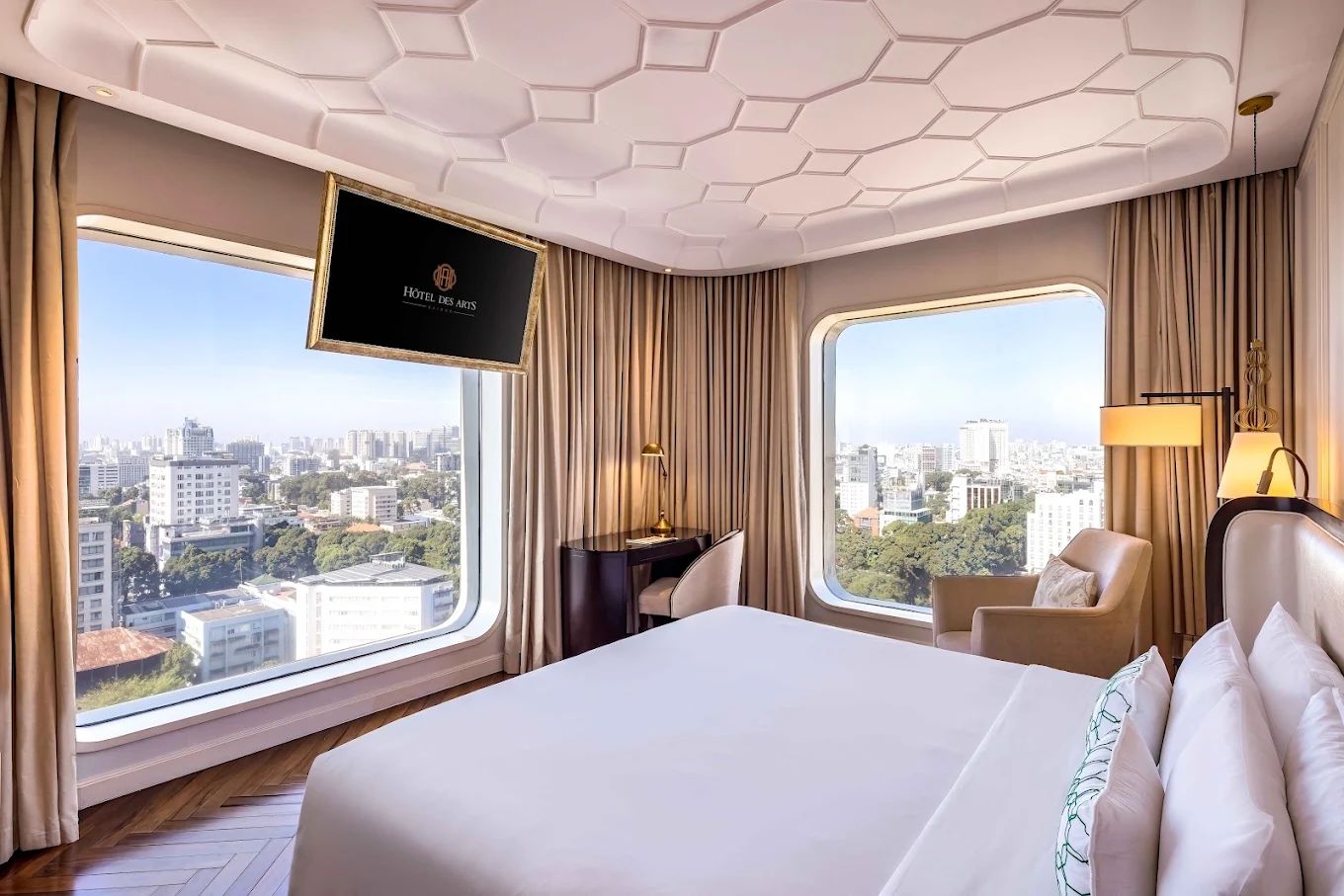 City view room with round windows at Hôtel des Arts Saigon MGallery