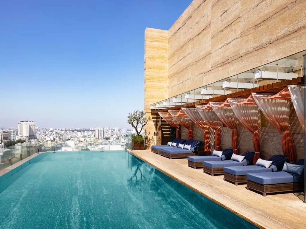 Rooftop infinity pool and cabanas at Hôtel des Arts Saigon MGallery