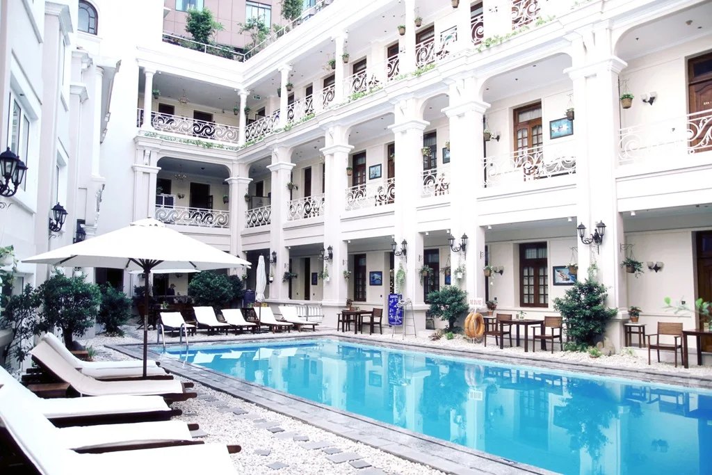 Courtyard pool inside the colonial wing of Hotel Grand Saigon