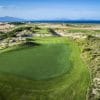 Dune-framed green with sea and mountain views at KN Golf Links Cam Ranh, Nha Trang