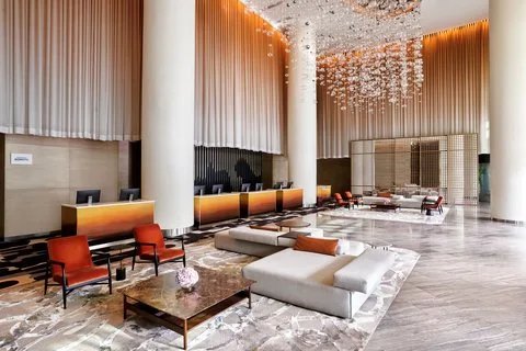 Lobby with glass chandelier at Le Méridien Saigon