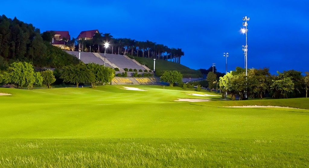 Floodlit fairway at dusk at Long Thanh Golf Club