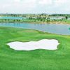 Hole 5 with lake carry at Royal Long An Golf & Country Club