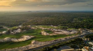 Aerial view of The Bluffs Grand Ho Tram golf course among sand dunes at sunset, Ho Tram