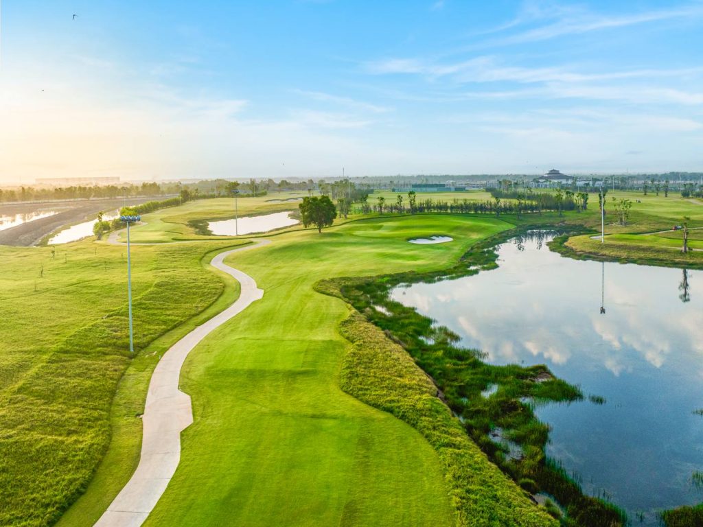 Fairway running beside a lake at Vinpearl Golf Leman