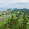 Vinpearl Golf Phu Quoc fairways with the Bai Dai coastline and resort in the distance