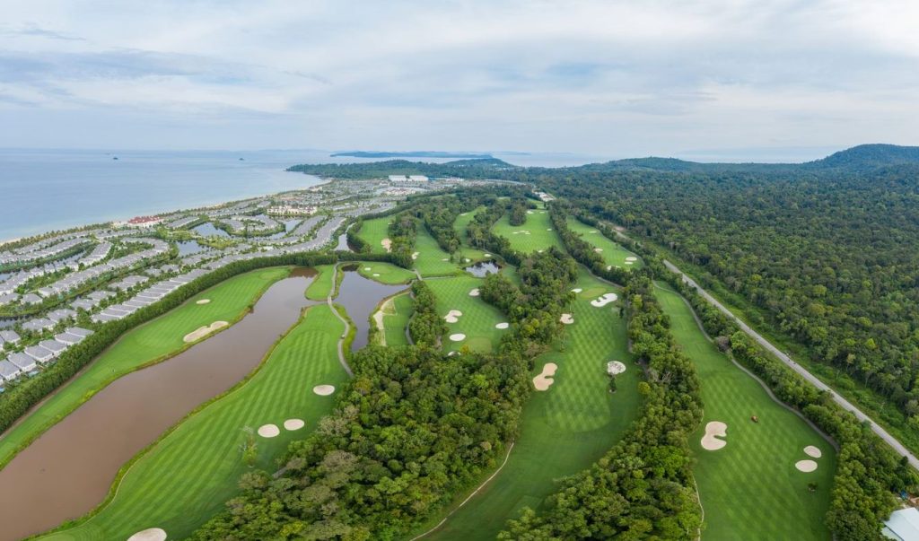 Vinpearl Golf Phu Quoc fairways with the Bai Dai coastline and resort in the distance