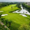 Green beside a lake at West Lakes Golf & Villas